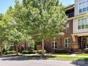 Attractive brick building with mature trees, showing the well-maintained facade and neighborhood feel at 871 Academy St, Charlotte, NC 28205
