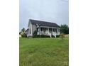 Charming single-Gathering home with a covered front porch and well-manicured lawn at 8720 Lee St, Mount Pleasant, NC 28124