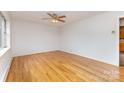 Bright living room features gleaming hardwood floors and neutral paint at 925 Rock Grove Church Rd, Salisbury, NC 28146
