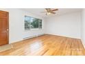 Inviting living room with hardwood floors and a large window at 925 Rock Grove Church Rd, Salisbury, NC 28146