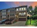 Modern townhouse boasting a brick facade, a two-car garage, and a private rooftop terrace perfect for entertaining at 11043 Stetler St, Charlotte, NC 28204