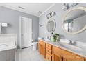 Spacious bathroom boasting double sink vanity, large mirror, soaking tub, and tile flooring at 1107 Rachel Anne Dr, Belmont, NC 28012