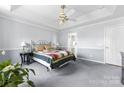 Inviting main bedroom featuring a tray ceiling, neutral walls, and cozy carpet at 1107 Rachel Anne Dr, Belmont, NC 28012