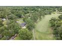 Beautiful home with golf course views, surrounded by lush greenery and mature trees at 120 Pinewood Ln, Rock Hill, SC 29730