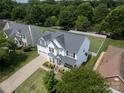 Aerial view showcasing the home's manicured lawn, fenced backyard, and neighborhood setting at 12303 Shadow Ridge Ln, Charlotte, NC 28273