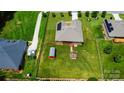 Birds-eye view of home with spacious backyard, storage shed, and partial fencing, perfect for outdoor living at 141 Tall Fern Loop, Mooresville, NC 28117