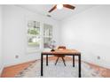 Cozy office with natural light, wooden floors, shutters, and a minimalist design for a productive workspace at 14923 Almondell Dr, Huntersville, NC 28078
