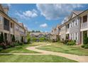 Townhome community features landscaped courtyards and walkways at 20216 Shaffer Bach Ln, Charlotte, NC 28277