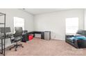 A clean spare bedroom space, currently setup as an office at 2340 Lanza Dr, Charlotte, NC 28215