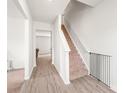 Bright entryway with hardwood floors and staircase leading to the upper level at 2340 Lanza Dr, Charlotte, NC 28215