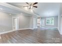 Open concept living space with hardwood flooring, high ceilings, and natural light at 501 Old Speedway Nw Dr # 1, Concord, NC 28027