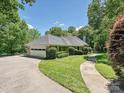 The property features a winding driveway, attached garage, and beautiful landscaping at 643 Baron Rd # 8, Waxhaw, NC 28173