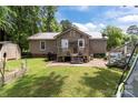 This backyard features a back porch, above ground pool, and storage shed at 716 Mooresville Rd, Salisbury, NC 28144