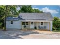Charming exterior view of home with welcoming porch, and lush greenery at 73 20Th Sw Ave, Hickory, NC 28602