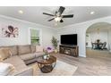 Inviting living room featuring a large television, an electric fireplace, and trendy decorations throughout at 910 W A St, Kannapolis, NC 28081