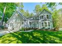 Charming two-story home with landscaped yard and mature trees giving it curb appeal at 9920 White Cascade Dr, Charlotte, NC 28269