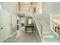 Bright foyer with tile flooring and stairs leading to the second floor at 9920 White Cascade Dr, Charlotte, NC 28269