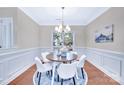Elegant dining room featuring a round table, comfortable seating, and beautiful natural lighting at 1006 Phar Lap Dr, Indian Trail, NC 28079