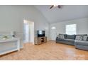 Bright living room with vaulted ceilings, gray sofa and light-colored wood floors at 110 Eighth St, York, SC 29745