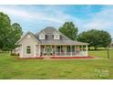 Charming home with a large front porch, green shutters, dormer windows, and a spacious lawn at 112 Ocean Dr, Shelby, NC 28152