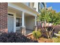 Spacious covered front porch with stylish stone accents on the support columns at 127 Walnut Cove Dr # D, Mooresville, NC 28117