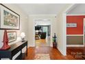 Welcoming entryway with hardwood floors leading into the living area at 185 Eastcliff Se Dr, Concord, NC 28025