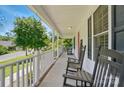 Inviting front porch with rocking chairs, perfect for relaxing and enjoying the outdoors at 185 Eastcliff Se Dr, Concord, NC 28025