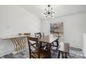 Contemporary dining area with a wooden table, unique lighting, and modern floors at 2315 Circle Dr, Great Falls, SC 29055