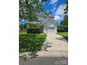 Inviting two-story home with a well-maintained lawn, a single car garage and mature shrubbery at 2924 Sedona Pl, Fort Mill, SC 29708