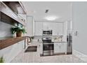 Updated kitchen with stainless steel appliances, granite countertops, and ample cabinet space at 3308 Selwyn Farms Ln # 5, Charlotte, NC 28209