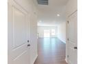 Inviting foyer with hardwood floors leading to an open-concept living area at 4009 Lawnview Dr, Charlotte, NC 28269