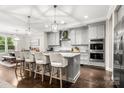 Modern kitchen with granite countertops, stainless steel appliances, and a large island at 4189 Island Fox Ln, Denver, NC 28037
