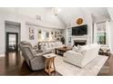 Bright living room with high ceilings, a fireplace, and stylish decor at 4189 Island Fox Ln, Denver, NC 28037