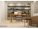 Bright office with wooden desk, shelves with decor, and a comfortable chair create an inspiring workspace at 4230 Skyboat Cir, Fort Mill, SC 29715
