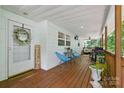Inviting covered porch with seating area, perfect for relaxing outdoors and enjoying the weather at 4230 Train Chaser Pl, Indian Land, SC 29707