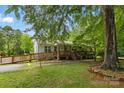 Charming one-story home with ramp access, lush greenery, and a welcoming front porch at 4230 Train Chaser Pl, Indian Land, SC 29707