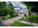 Charming two-story home featuring manicured landscaping and a spacious two-car garage at 4323 Bright Rd, Charlotte, NC 28214
