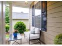 Cozy covered porch with comfortable seating, perfect for enjoying the outdoors at 4323 Bright Rd, Charlotte, NC 28214
