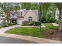 Inviting exterior showcasing lush landscaping, a well-maintained lawn, and a cozy street view at 4557 Panther Pl, Charlotte, NC 28269