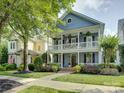 Charming two-story home with double porches and professional landscaping in a sidewalk neighborhood at 628 Bracket St, Fort Mill, SC 29708