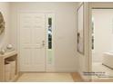 Bright foyer showcasing a stylish entrance with a light-colored door, neutral walls, and wood-look floors at 6298 Fairfax Ct, Maiden, NC 28650