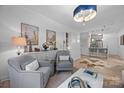Open-concept living area showcases elegant furnishings, neutral tones, and seamless flow to the kitchen, ideal for modern living at 630 Calvert St # 111, Charlotte, NC 28208