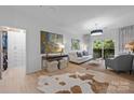 Cozy living room features a comfortable seating arrangement, natural light, and stylish decor, creating a relaxing ambiance at 630 Calvert St # 111, Charlotte, NC 28208