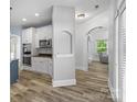 Bright kitchen featuring white cabinets, stainless steel appliances, and a cozy breakfast nook at 1009 Jerry Ln, Matthews, NC 28105