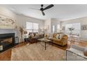 Bright living room with hardwood floors, fireplace, and comfortable seating area at 14034 Holly Springs Dr, Huntersville, NC 28078