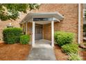 Brick building entrance featuring clearly visible unit numbers and well-maintained landscaping at 14979 Santa Lucia Dr # 2408, Charlotte, NC 28277