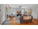 Bright living room boasting hardwood floors, a cozy fireplace, and an open layout at 15830 Waterfront Dr, Huntersville, NC 28078