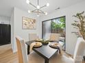 Cozy dining area with modern light fixture and sliding glass doors leading to the outdoors at 2324 Brookview Ct, Rock Hill, SC 29732