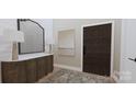Inviting entryway featuring a wooden console table, stylish mirror, lamps, and a patterned rug at 2413 Cross Country Rd, Charlotte, NC 28270