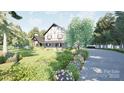 Elegant Tudor-style home surrounded by lush landscaping and mature trees along a private drive at 2413 Cross Country Rd, Charlotte, NC 28270